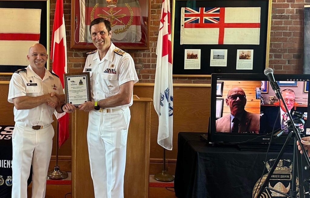 2023 RCNBF Vice-Admiral Mark Norman Leadership Award winner, Chief Petty Officer 2nd Class Michael Tibbetts of HMCS Corner Brook is presented the award by VAdm Angus Topshee with RCNBF Champion VAdm (Ret’d) Mark Norman and RCNBF President LCdr (Ret’d) Tom Riefesel looking on.